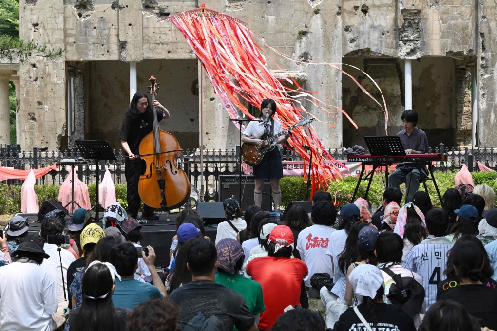 South Korean indie-pop musician Haepa performs in front of the former North Korean Workers Party Headquarters on the sidelines of the DMZ Peace Train Festival near the North Korean border on Sunday. Photo: AFP