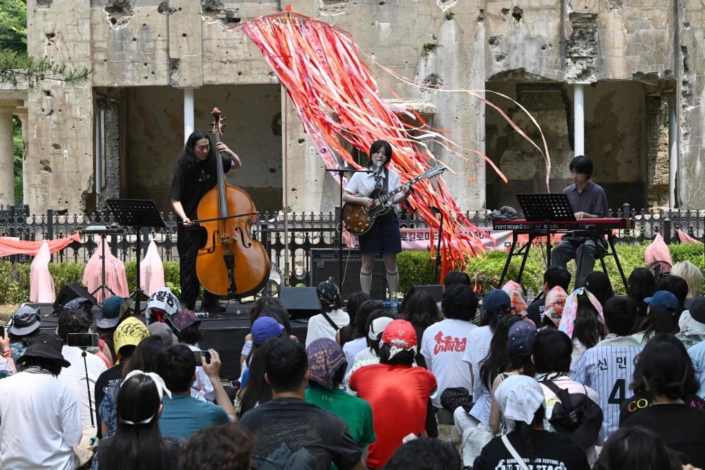 South Korean indie-pop musician Haepa performs in front of the former North Korean Workers Party Headquarters on the sidelines of the DMZ Peace Train Festival near the North Korean border on Sunday. Photo: AFP