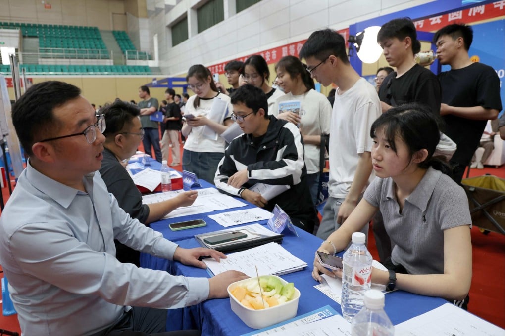 Recruiters talk to jobseekers at a job fair in China’s eastern Jiangsu province on May 22. Photo: AFP