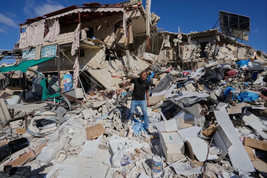 A man inspects his destroyed house after returning to Tibnin village, south Lebanon, on Monday following the announcement of an initial ceasefire agreement between the United States and Iran. Photo: AP