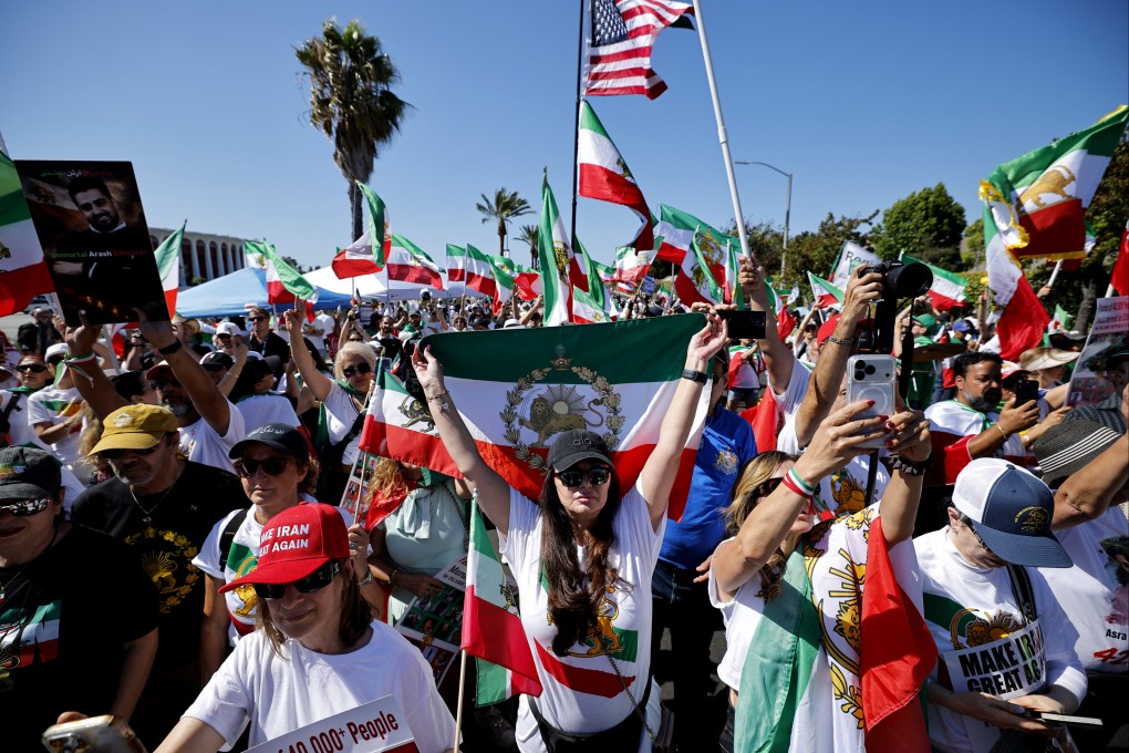 Football fans wave Iran and US flags during a protest outside Los Angeles Stadium (SoFi Stadium) ahead of the 2026 World Cup football match between Iran and New Zealand in Inglewood, California on Monday. Photo: Reuters