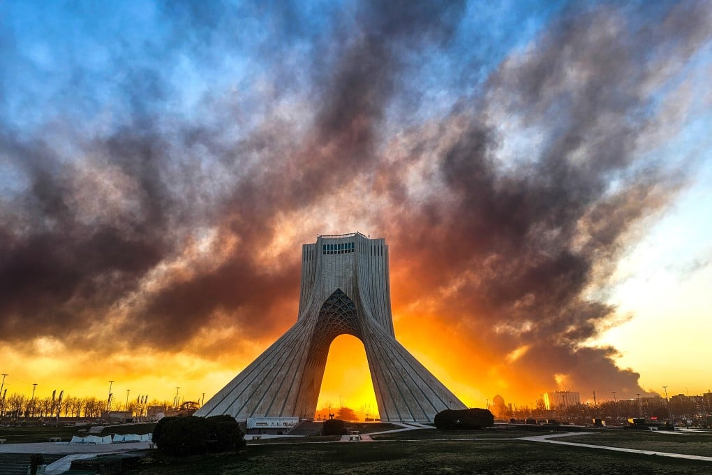 Smoke rises behind the Azadi Tower in Tehran following a US-Israeli military strike on Iran in early March. Photo: ISNA/AP
