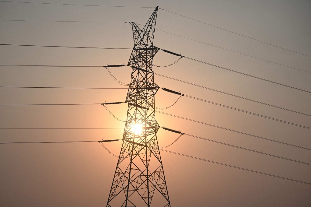 The sun sets next to power lines along San Fernando town,  north of the Philippines’ capital of Manila. Photo: AFP