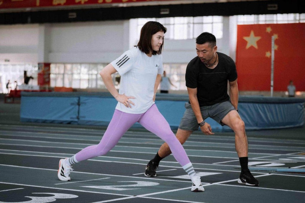 Ivan Ho working with China’s multiple-time 100m hurdles champion Wu Yanni. Photo: Ivan Ho