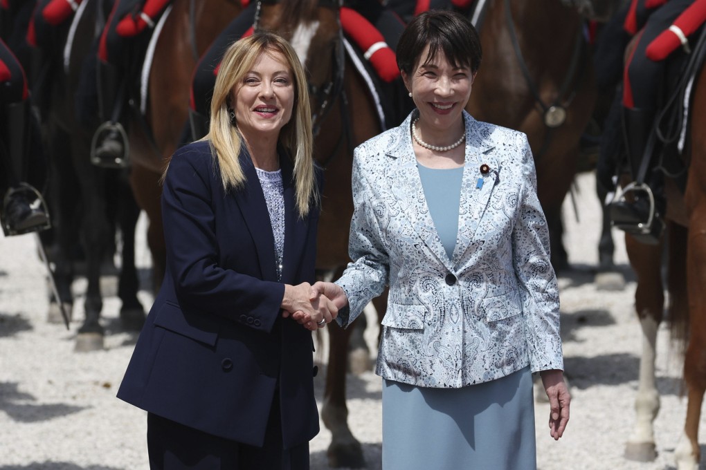 Japanese Prime Minister Sanae Takaichi (right) shakes hands with her Italian counterpart Giorgia Meloni at a welcoming ceremony in Rome on Monday. Photo: Kyodo