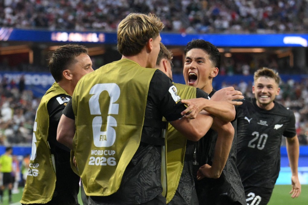 New Zealand’s Elijah Just (right) celebrates with teammates after scoring his team’s second. Photo: AFP