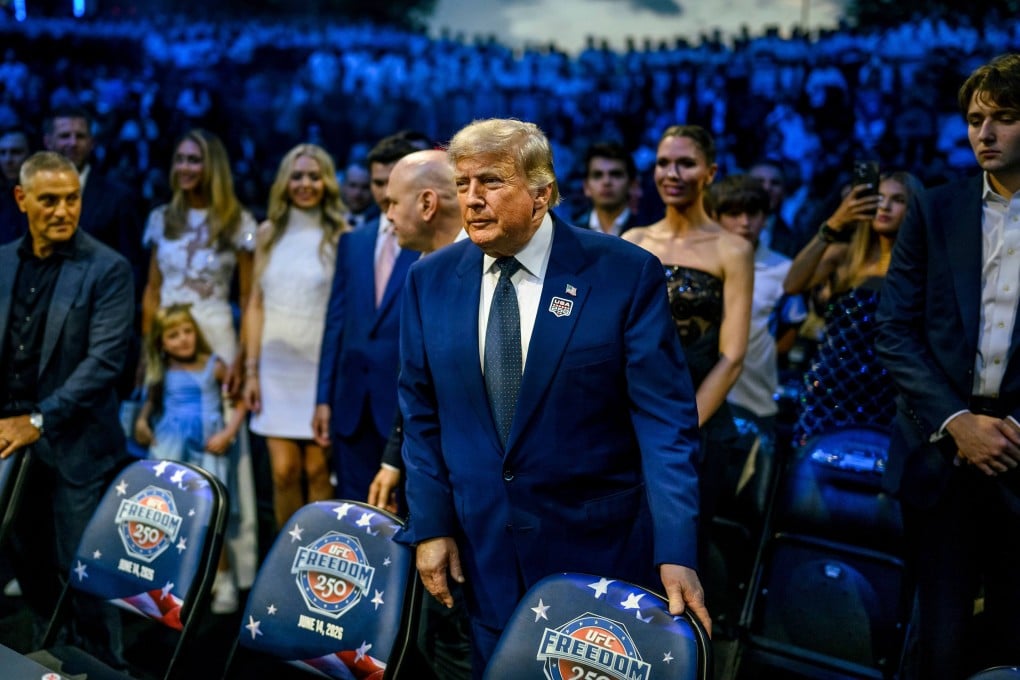 US President Donald Trump prepares to take his seat at the start of UFC Freedom 250 at the White House on Sunday. Photo: dpa