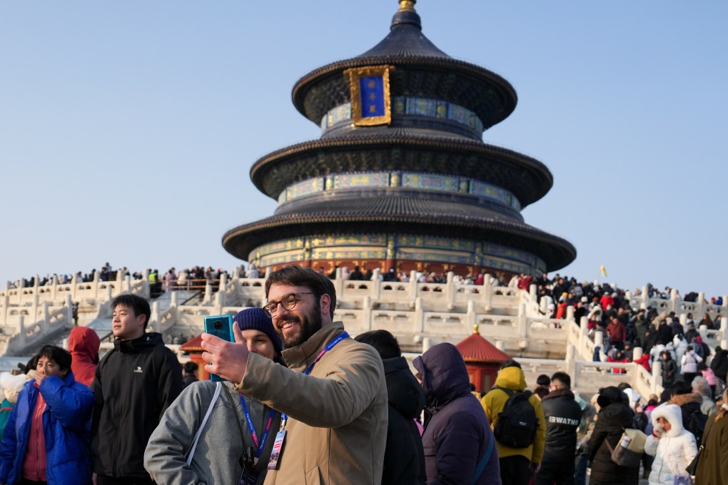 Italian tourists (front) pose for a selfie at the Temple of Heaven in Beijing, China. Photo: Xinhua