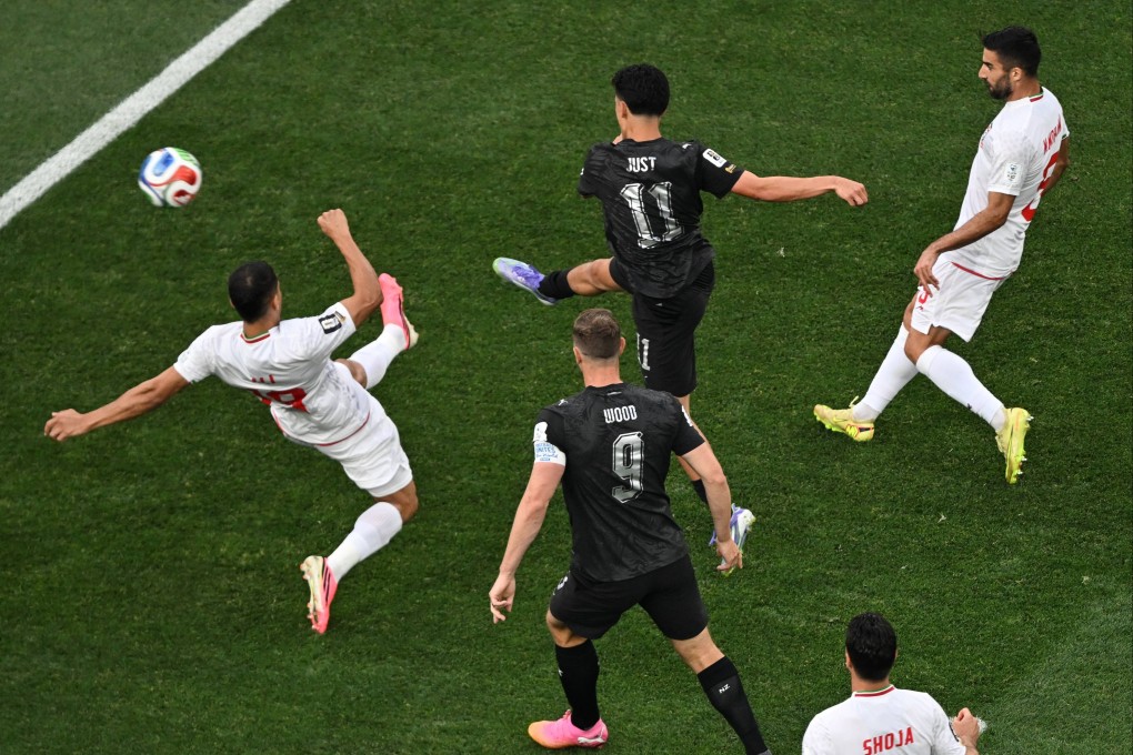 New Zealand’s Elijah Just scores his side’s opening goal against Iran at the World Cup. Photo: dpa
