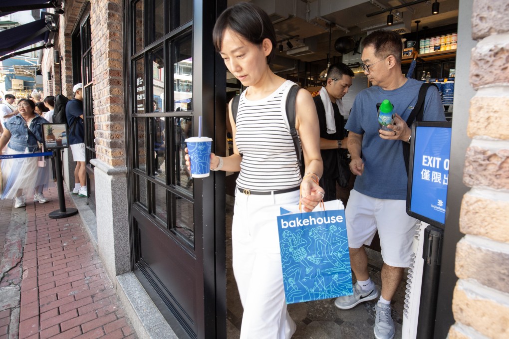 Customers leave a Bakehouse shop in Causeway Bay with their purchases on July 26, 2025. Photo: Antony Dickson