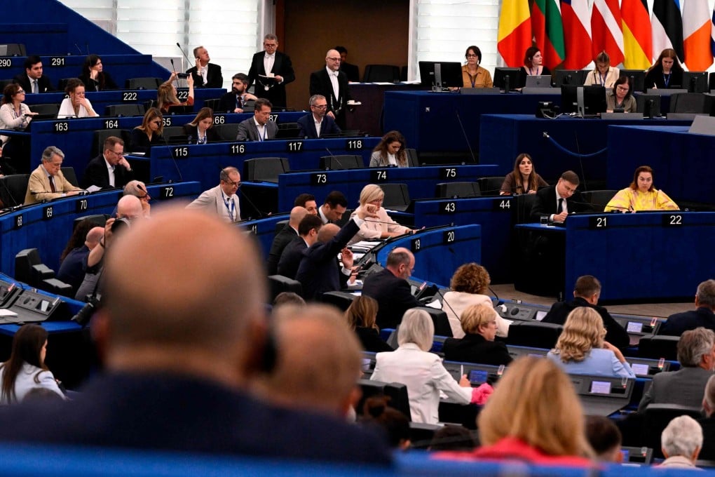 Members of the European Parliament take part in an electronic vote on the adjustment of customs duties and opening of tariff quotas for the import of certain US goods in Strasbourg on Tuesday. Photo: AFP