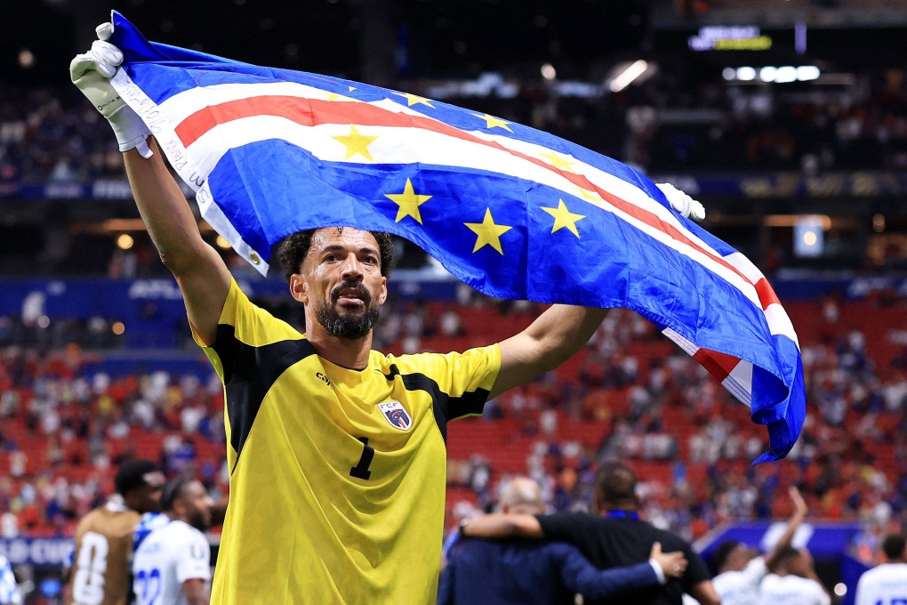 Vozinha, Cabo Verde's goalplayer, carries the national flag after the team's draw against Spain in the US city of Atlanta on Monday. Photo: Getty Images via AFP