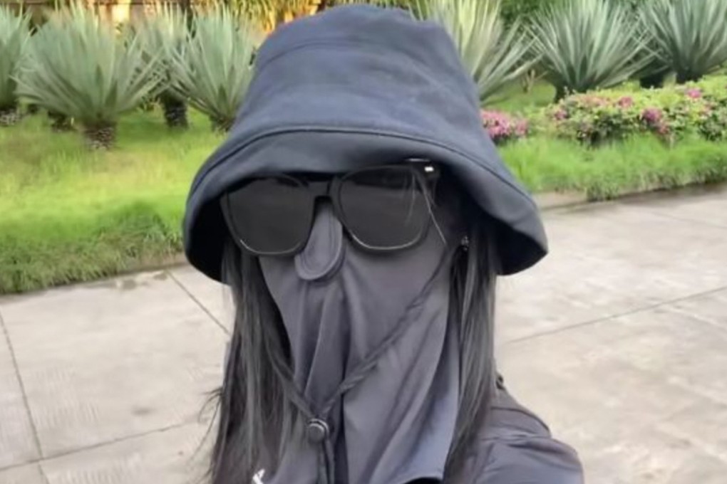 A Chinese woman who took extreme sun protection measures by covering her entire face with a hat and mask after applying sunscreen has developed skin redness and itchiness. Photo: Baidu
