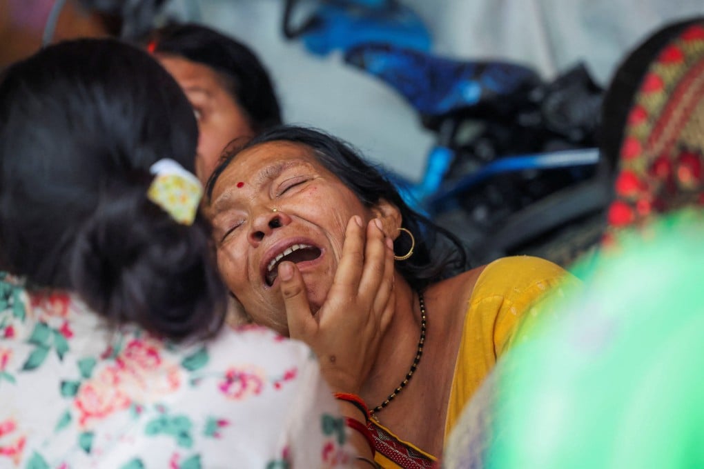 The mother of one of the Indian seafarers killed in the US strike on the tanker MT Settebello mourns the death of her son in Deoria, Uttar Pradesh, on June 12. Photo: Reuters
