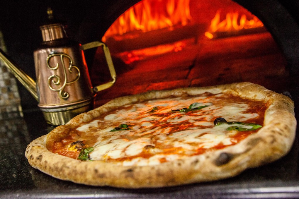 Pizza originated in Naples, Italy, and the pizzas found there are quite different from those that can be bought from Western chains. Photo: NurPhoto via Getty Images