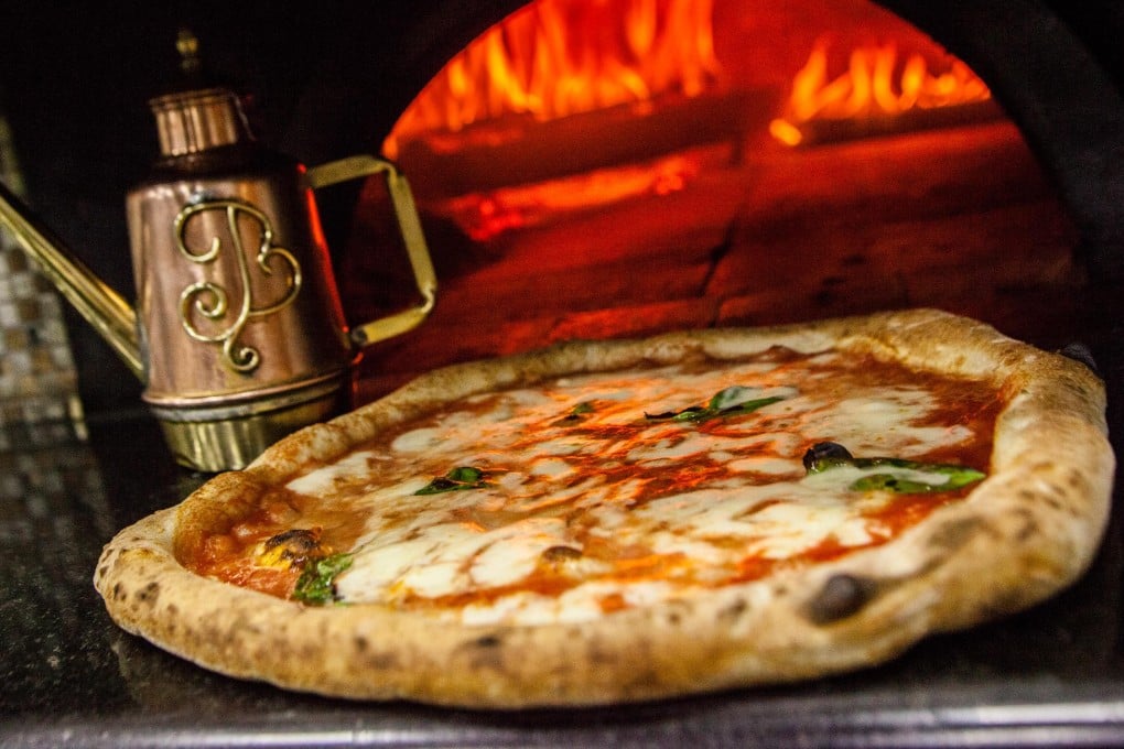 Pizza originated in Naples, Italy, and the pizzas found there are quite different from those that can be bought from Western chains. Photo: NurPhoto via Getty Images