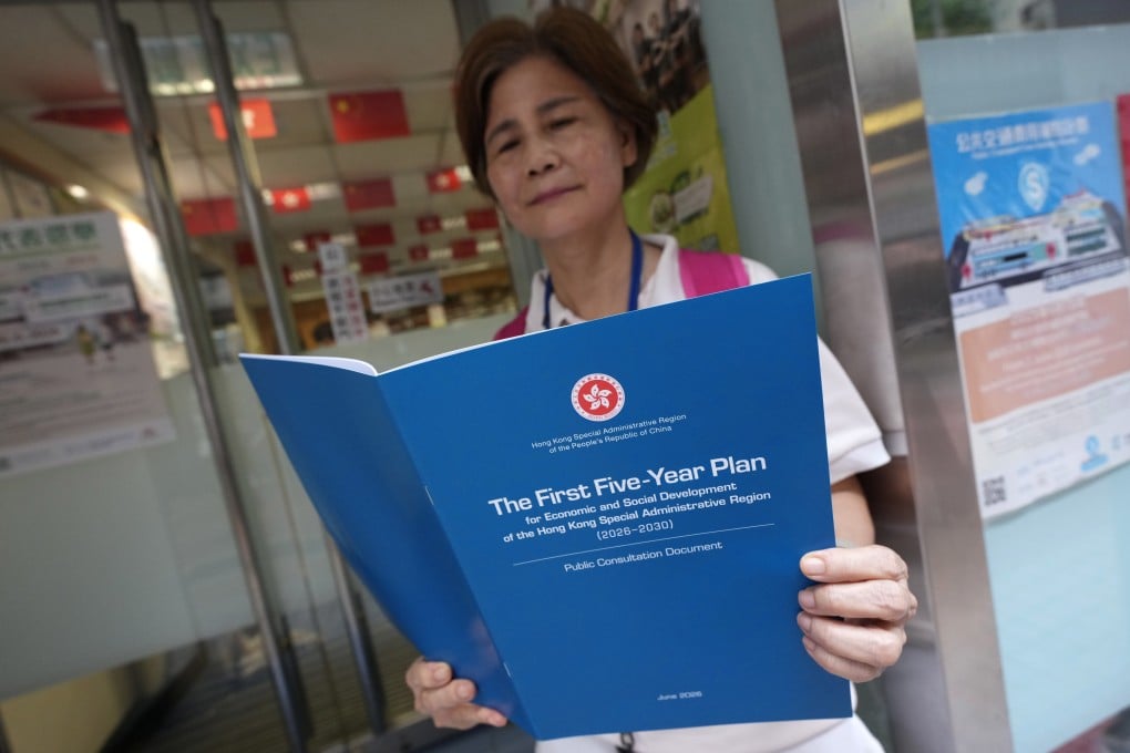 A member of the public collects a copy of the consultation document for Hong Kong’s first five-year plan from the Wan Chai District Office on June 15.  Photo: Karma Lo