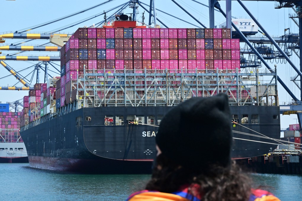 A person taking a boat tour watches freight ships full of containers at the Port of Los Angeles, California, on May 9. Photo: AFP via Getty Images / TNS