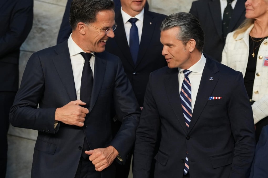 Nato Secretary General Mark Rutte (left) banters with US Defence Secretary Pete Hegseth during a group photo taking at Nato headquarters in Brussels on Thursday. Photo: AP