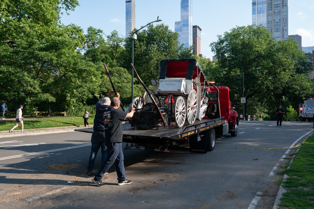 A damaged horse carriage being removed from Central Park after it overturned. Photo: TNS