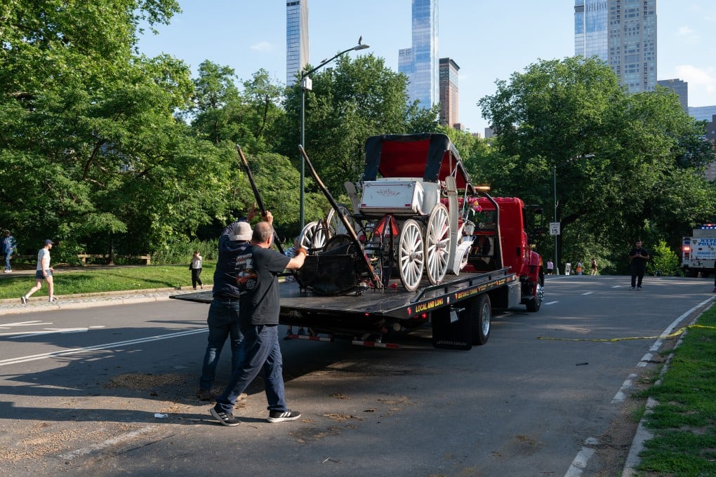 A damaged horse carriage being removed from Central Park after it overturned. Photo: TNS