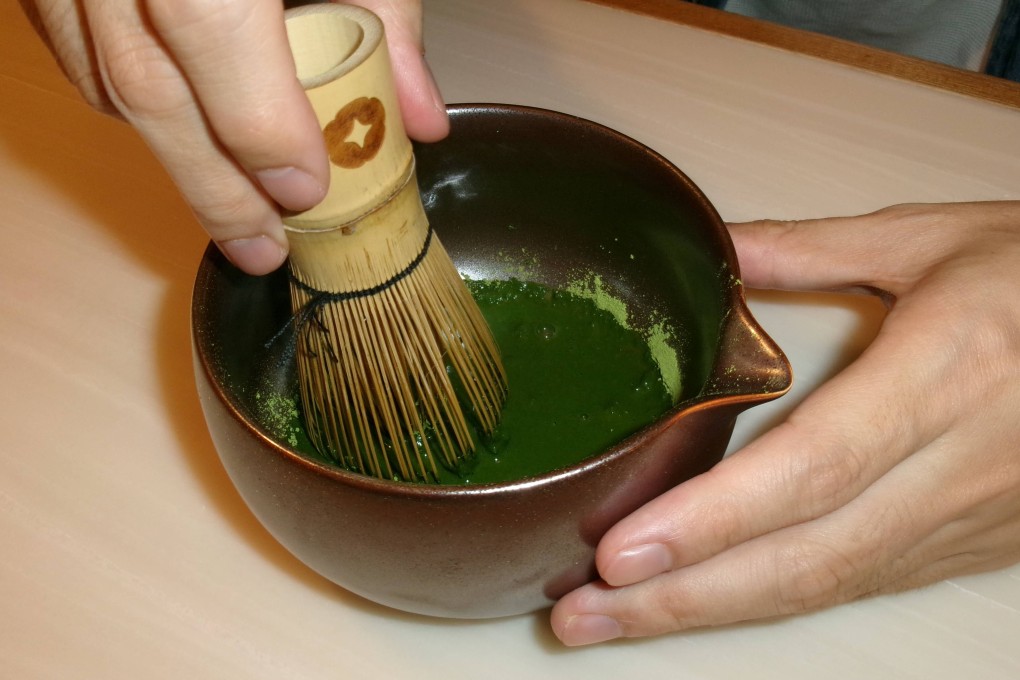 Gavin Yeung, co-founder of Hong Kong matcha brand Celadon, stirs matcha with a traditional tea whisk. The company uses powder from China’s Zhejiang province to spotlight the green tea’s true Chinese origins, which, the founders say, are contrary to “everything this generation knows about matcha”. Photo: Chloe Loung