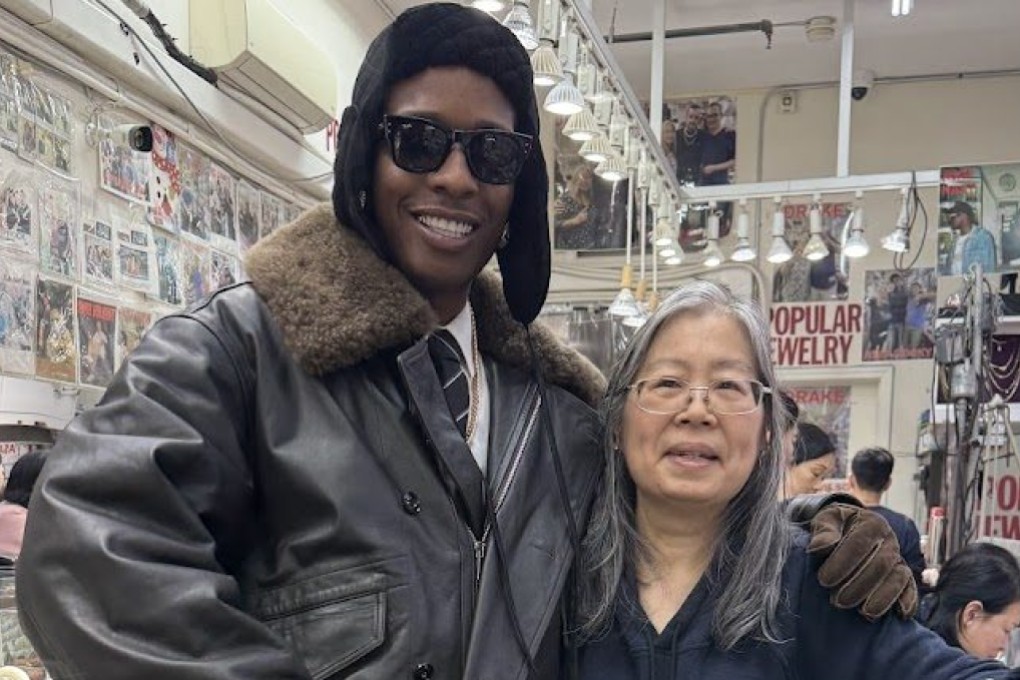 A$AP Rocky poses with Eva Sam at Sam’s Chinatown goldsmith shop Popular Jewelry, which has become a hip-hop landmark, in New York City. The rapper has developed a friendship with Macau-born Sam since his first visit in the early 2010s. Photo: Popular Jewelry