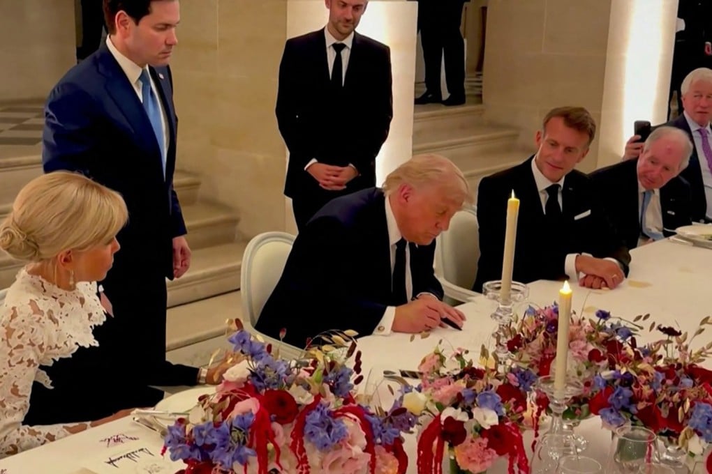 US President Donald Trump (centre) signs a memorandum of understanding with Iran in Versailles, France on June 17 as French President Emmanuel Macron (right) and his wife Brigitte Macron (left) look on. Photo: AFP and X/Scavino47