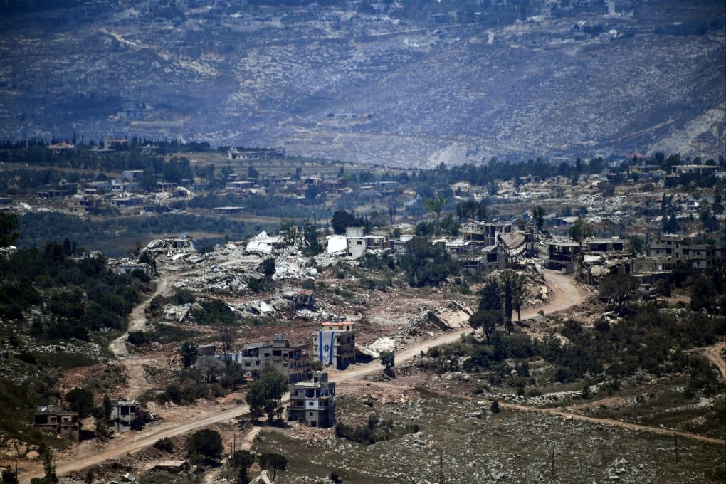 An Israeli flag hangs from a damaged building in a southern Lebanon border village, where Prime Minister Benjamin Netanyahu has ruled out any military withdrawal. Photo: Reuters