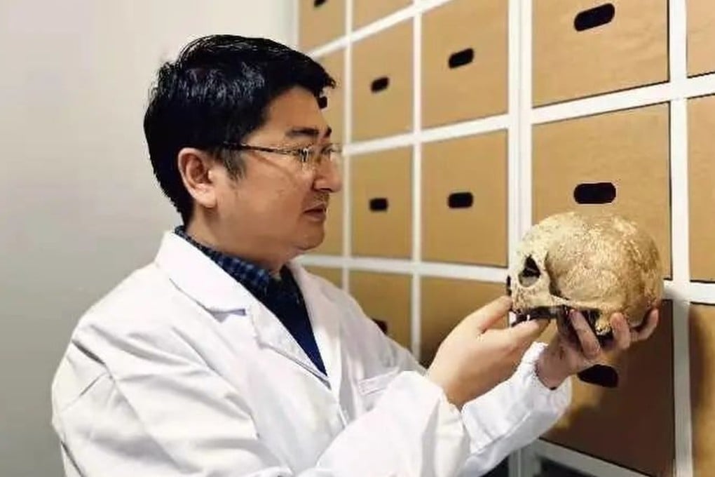 Wen Shaoqing, corresponding author of a paper published in Nature Communications, observes the collected remains. Photo: Handout