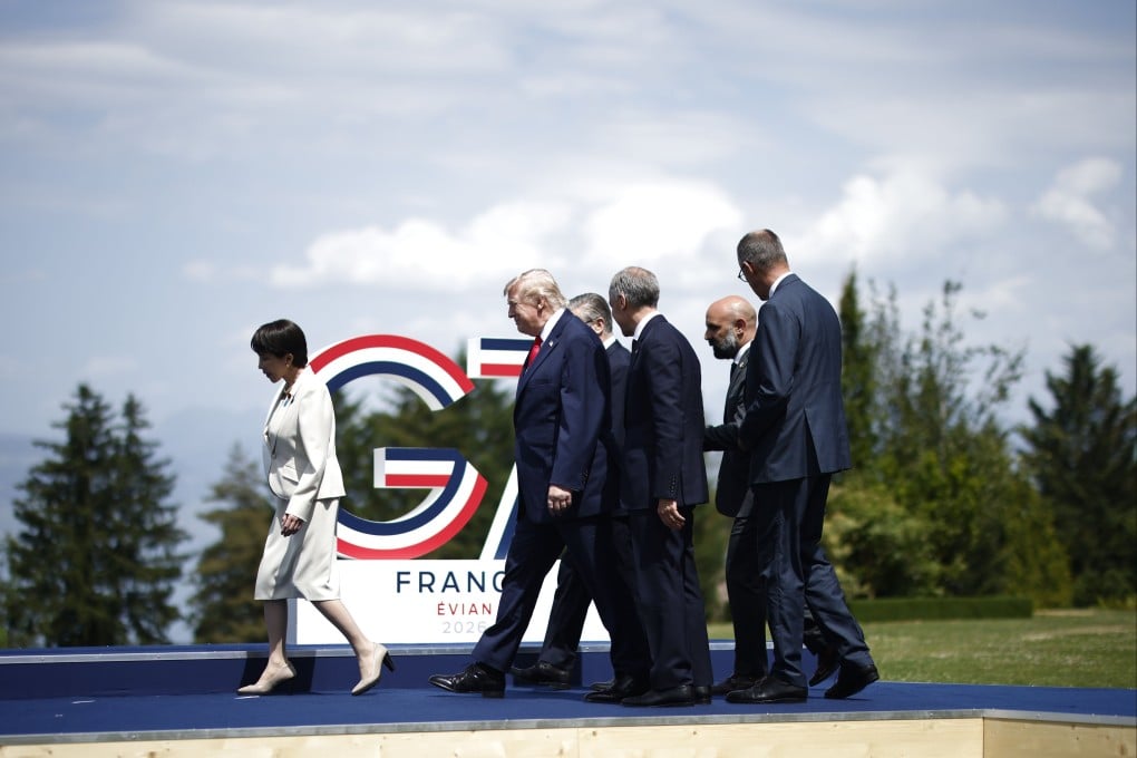 (From left) Japanese Prime Minister Sanae Takaichi, US President Donald Trump, Canadian Prime Minister Mark Carney and German Chancellor Friedrich Merz prepare for a group picture at Hotel Royal during the G7 summit in Evian-les-Bains, France on June 16. Photo: EPA