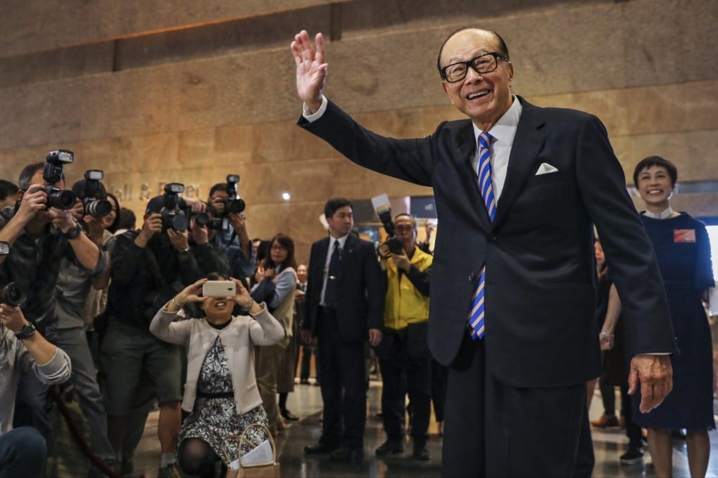 Li Ka-shing meets the media at the Hong Kong Convention and Exhibition Centre in Wan Chai in January 2019. The multibillionaire tycoon is arguably the most well-known Teochew person in Hong Kong. Photo: Felix Wong