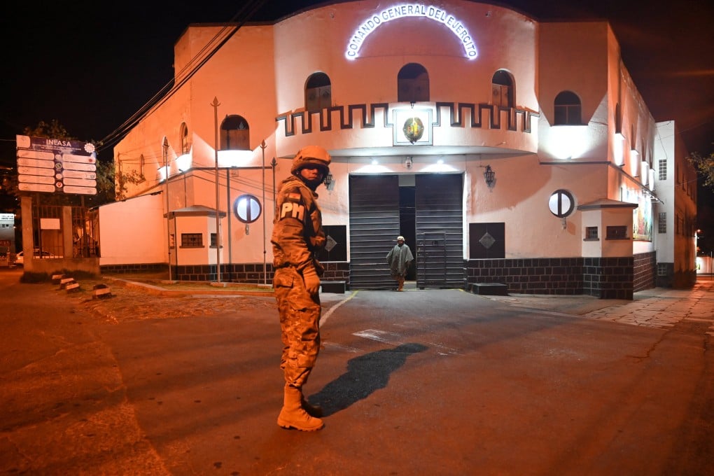 A soldier stands outside the Estado Mayor headquarters in La Paz on Saturday, after Bolivian President Rodrigo Paz declared a nationwide state of emergency following weeks of violence and blockades. Photo: Reuters