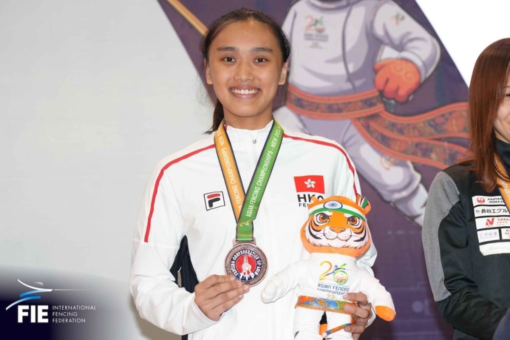 Daphne Chan proudly shows off her Asian Fencing Championships bronze medal. Photo: FIE