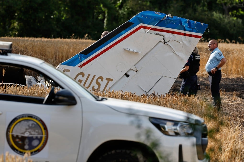 Forensic technicians on Saturday examine the wreckage of the Cessna 421 that crashed while approaching La Baule-Escoublac airfield in France. Photo: AP