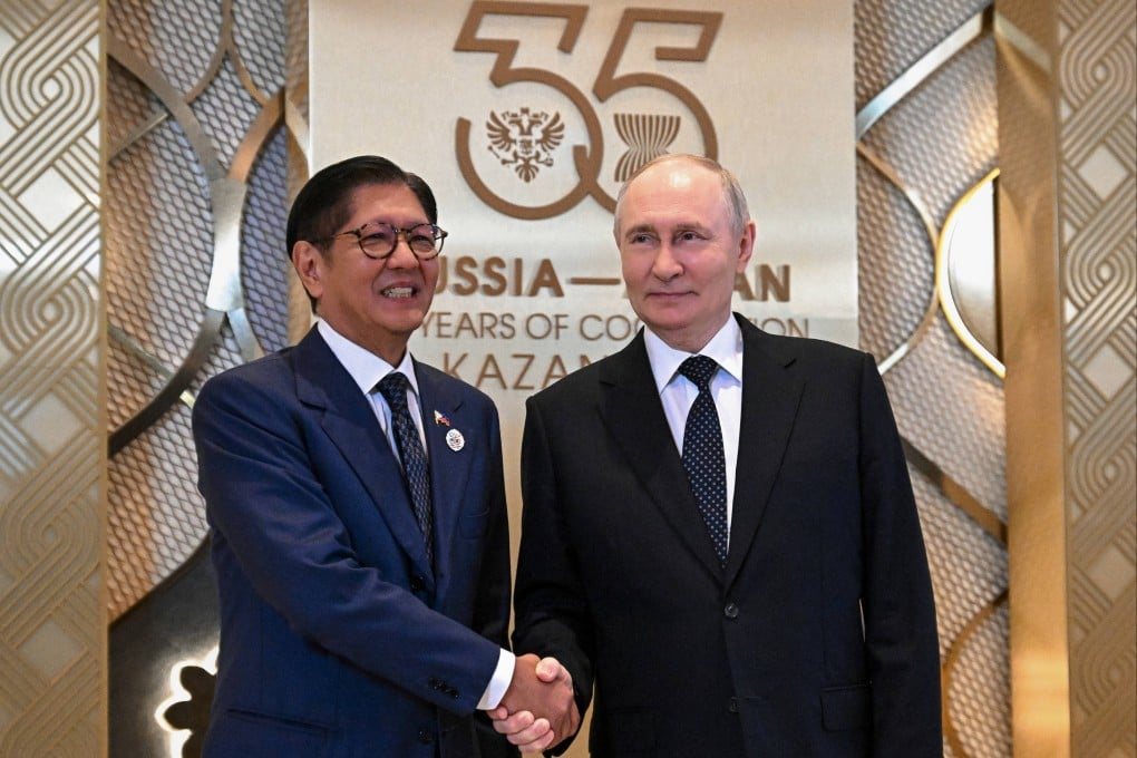 hilippine President Ferdinand Marcos Jnr shakes hands with Russian President Vladimir Putin in Kazan, Russia, on Wednesday. Photo: Sputnik via AP
