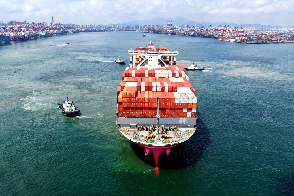 A container ship sails out of the port in Qingdao in China's eastern Shandong province. China is one of the key players in Apec, whose 21 member economies account for nearly 60 per cent of global gross domestic product. Photo: AFP