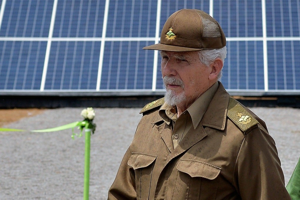 Ramiro Valdes in 2019. attends the cornerstone laying ceremony of a photovoltaic park at Mariel Special Economic Development Zone in Artemisa province, Cuba during the visit of Britain’s Prince Charles to the island on March 26, 2019. Ramiro Valdes Menendez, a close associate of brothers Fidel and Raul Castro and founder of the Cuban intelligence services, has died at the age of 94, Cuban President Miguel Diaz-Canel announced on June 21, 2026. (Photo by YAMIL LAGE / AFP)
