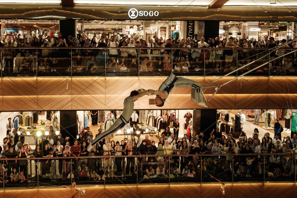 Russian flying trapeze artists perform in the atrium of Pondok Indah Mall 2 in Jakarta on June 19. Photo: AFP