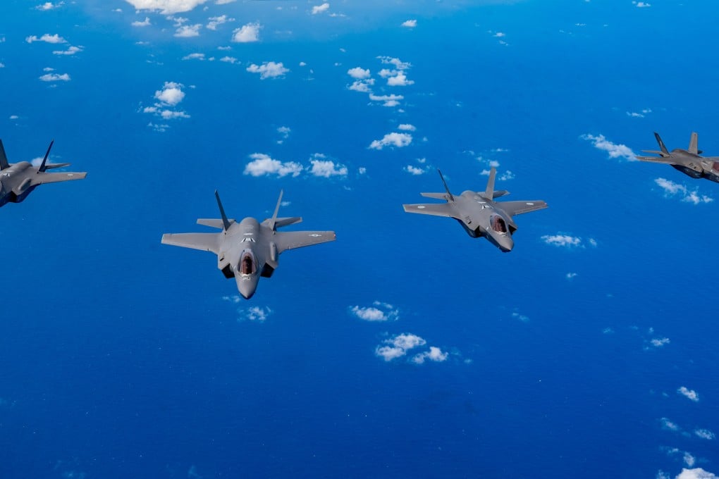From the left, a Royal Australian Air Force F-35A, a US Air Force F-35A Lightning II, a Japan Air Self-Defence Force F-35A, and a US Marine Corps F-35B Lightning II fly over the US Pacific Command area of responsibility during exercise Cope North on February 7. Photo: US Air Force