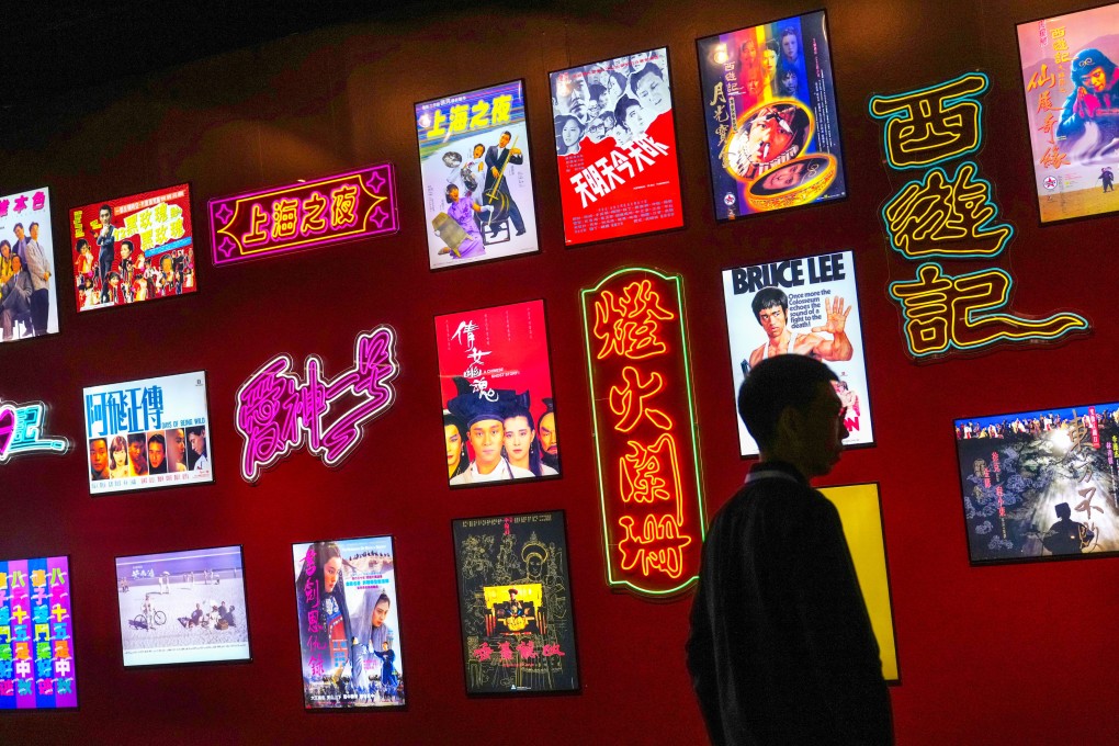 A neon-lit poster wall celebrates classic Hong Kong cinema at the “Hong Kong Film Archive Stories: Treasure Hunting for 25 Years” exhibition. Photo: Karma Lo