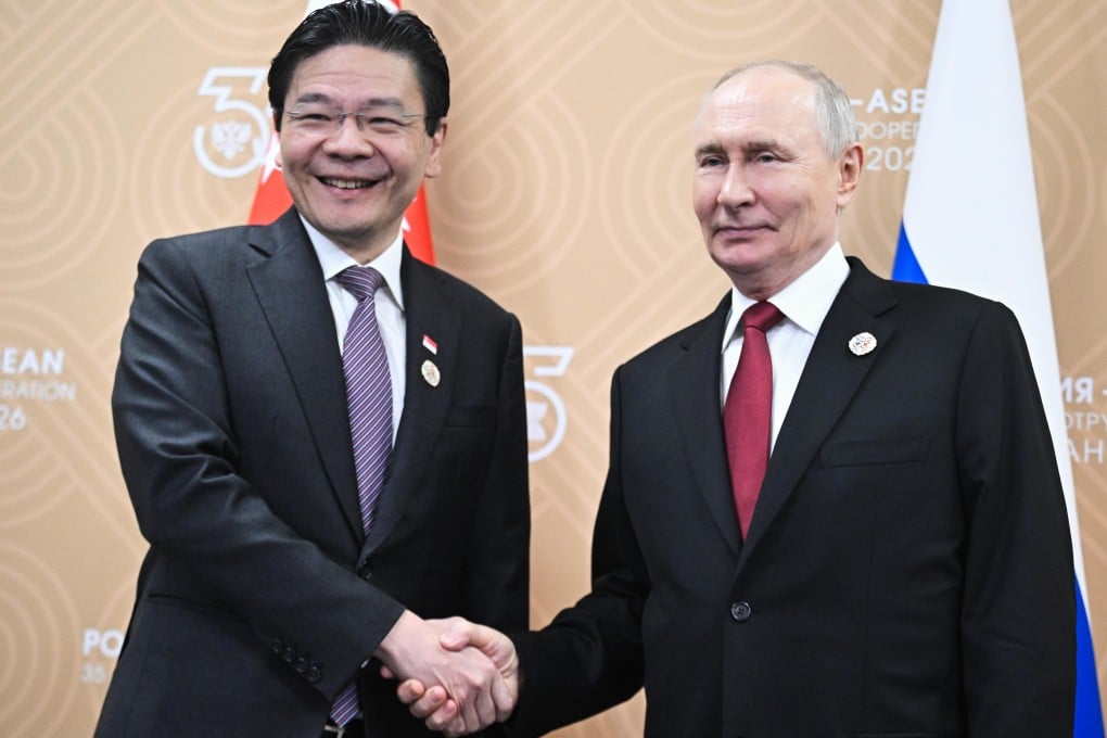 Singaporean Prime Minister Lawrence Wong (left) and Russian President Vladimir Putin shake hands during their meeting on the sidelines of the Russia-Asean Summit in Kazan on Thursday. Photo: 
Sputnik/AP