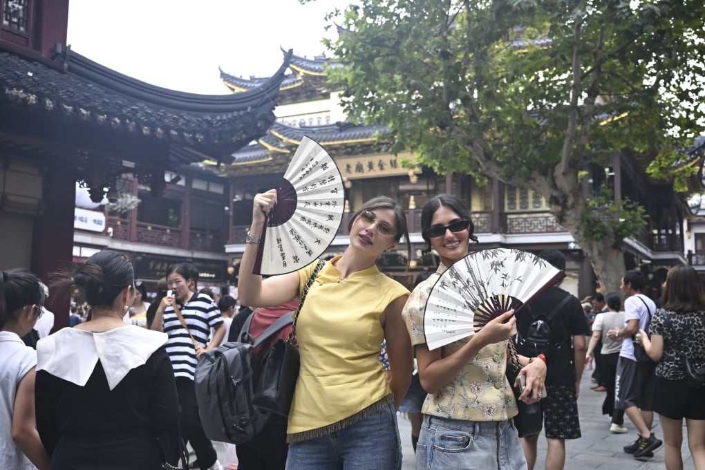 Russian visitors in Shanghai. A think tank is urging authorities to provide inbound visitors with app-loaded local phones to make easier payments in China as their own overseas devices often lack those tools. Photo: Xinhua