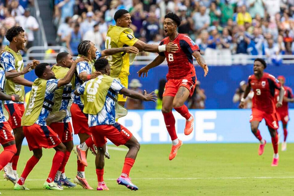 Cabo Verde’s Kevin Pina shares the joy of scoring his country's first World Cup finals goal with team reserves in their match against Uruguay at Hard Rock Stadium in Miami on Sunday. Photo: dpa