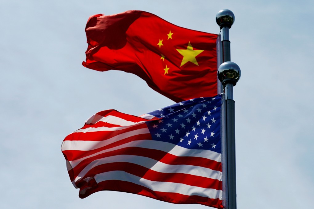 Chinese and U.S. flags flutter near the Bund in Shanghai. Photo: Reuters