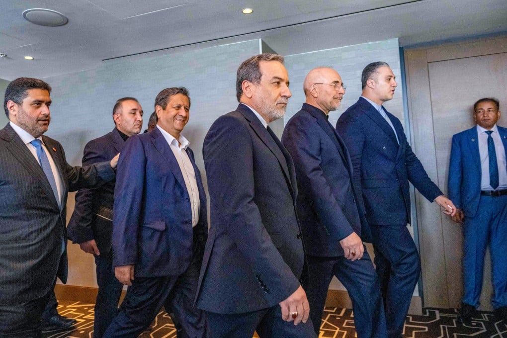 Iran’s delegation, including Foreign Minister Abbas Araghchi (centre), arrive for a quadrilateral meeting on Sunday in Switzerland. Photo: AFP