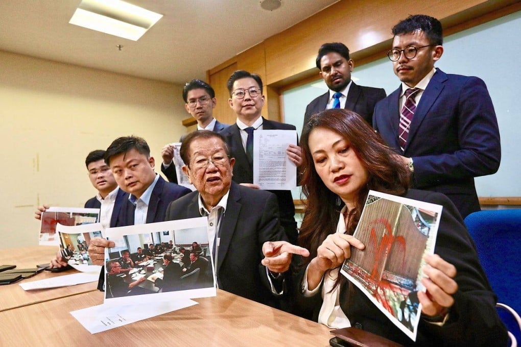 Michael Chong (sitting, second from right) and other MCA representatives point to photos showing acts of violence committed by loan sharks in Malaysia. Photo: The Star