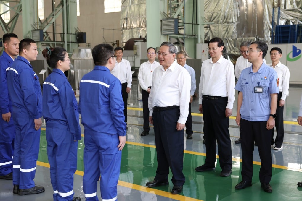 Premier Li Qiang discusses the research and development of nuclear power and petrochemical equipment at a facility in Dalian, Liaoning province, on Monday. Photo: Xinhua