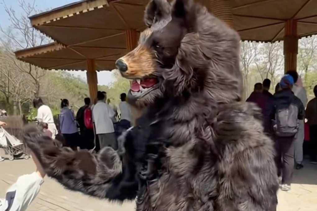 A worker in a bear costume engages with visitors at a zoo in China, inspiring Luohe Zoo’s recent advertisement for similar performers. Photo: RedNote