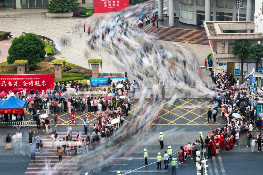 In this long exposure photo, students arrive at a school on the first day of China’s National Higher Education Entrance Examination, known as gaokao, in Huaian, Jiangsu province on June 7. Photo: AFP